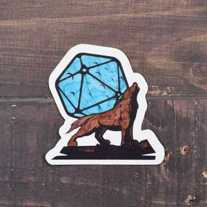 May include: A sticker featuring a brown wolf howling at a blue and white 20-sided die.