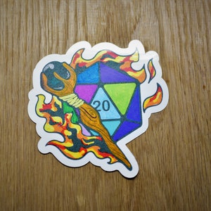 May include: A colorful 20-sided die with a wooden staff, set against a background of flames.