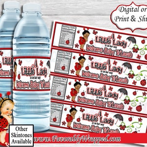 May include: Water bottle labels with a red ladybug design and the text "A Little Lady is on her way Welcome Baby Te'Leeah".