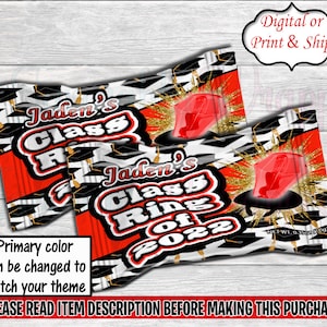 May include: Two red and black candy wrappers with gold glitter and a black and white checkered pattern. The wrappers have the text "Jaden's Class Ring of 2022" on them.