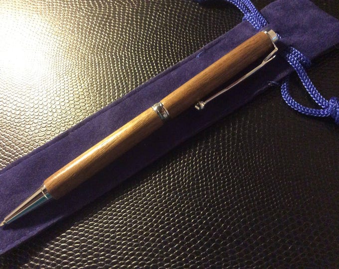 Handcrafted Walnut ballpoint pen with silver accents