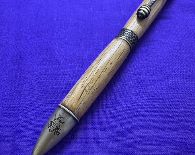 English Oak ballpoint pen with HoneyBee fittings. In antique polished bronze metal.