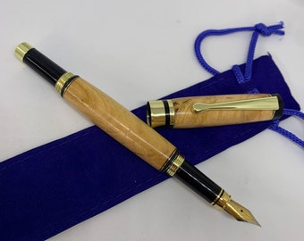 Cherry wood fountain pen with gold fittings, handcrafted in Scotland