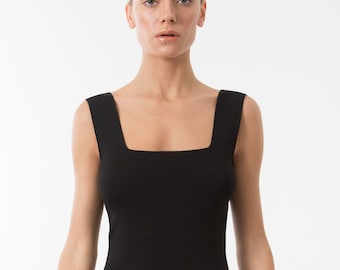May include: A black sleeveless top with a square neckline. The top is made of a ribbed fabric and has a fitted silhouette.