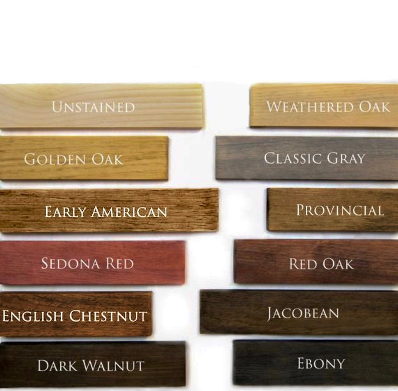 May include: Wood stain colour samples in various shades of brown, red, grey, and black. The samples are labelled with the names: Unstained, Golden Oak, Early American, Sedona Red, English Chestnut, Dark Walnut, Weathered Oak, Classic Grey, Provincial, Red Oak, Jacobean, and Ebony.