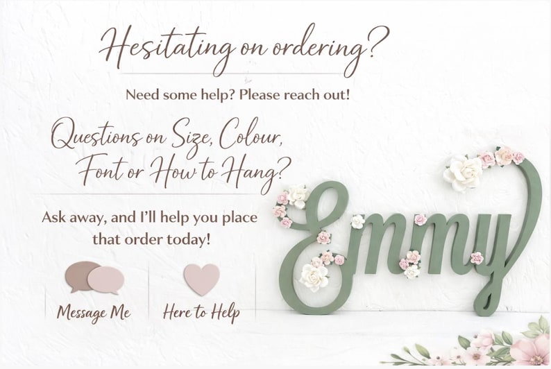May include: Sage green wooden name sign, "Emmy", decorated with delicate floral accents. The name is styled in a cursive font and decorated with small, light pink and white flowers. The image also contains text.