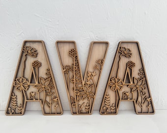 Botanical baby name wall art Wooden baby name wall sign Woodland nursery name letters Engraved wooden baby name Nature inspired baby decor