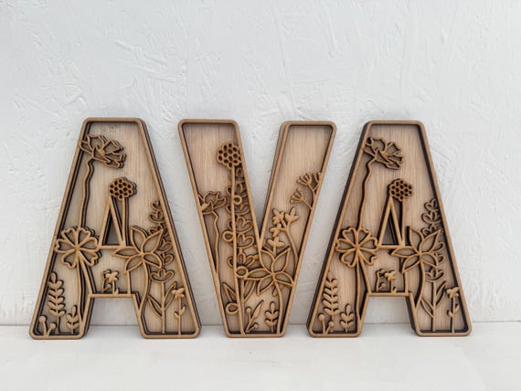 Botanical baby name wall art Wooden baby name wall sign Woodland nursery name letters Engraved wooden baby name Nature inspired baby decor