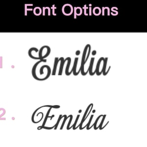 May include: Image showing two font choices for the name "Emilia". The text "Font Options" is at the top in pink. The name "Emilia" is displayed in two different cursive fonts, with the numbers 1 and 2 in pink next to each option.