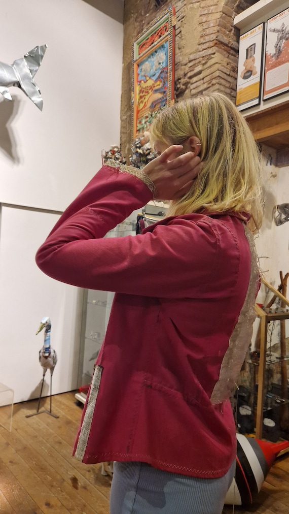 Pink blazer created with plastics and recycled materials
