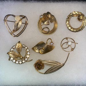 Lot of 7 Vintage Gold tone Brooches  Circular Rhinestone More