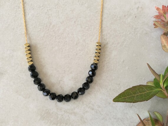 Gold and black necklace. Crystal and hematite delicate beaded | Etsy