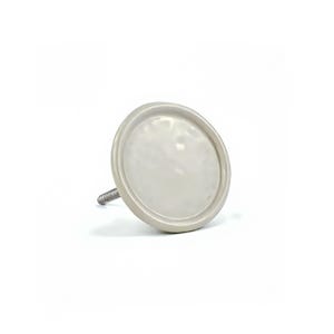 May include: A light grey ceramic cabinet knob with a round, slightly recessed face. The knob has a simple, modern design and a threaded metal post for attachment. The knob is shown against a white background.