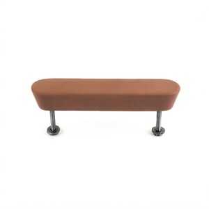 May include: A brown cabinet pull with a rectangular shape and rounded edges. The pull is mounted on two silver screws with washers, designed for easy installation. This hardware is suitable for drawers and cabinets.