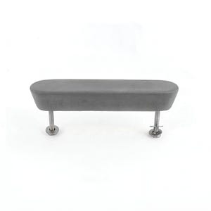 May include: A grey, rectangular furniture handle with rounded edges, mounted on two silver screws. The handle has a soft, velvety texture and is designed for easy gripping. The hardware is made of metal.