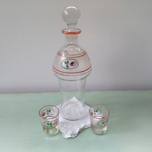 Antique enameled liqueur carafe and glasses