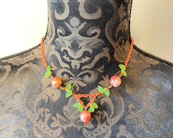 Peach toned necklace with green glass leaves and plastic orange balls a Vintage Original from 1940's Costume Jewellery Statement piece