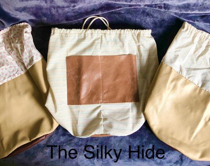 Duffel Bags, round bottom duffel bags, fabric and leather duffel bags, travel bags, shoe bags, lunch bag, toiletry bag