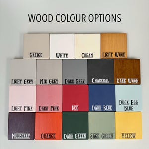 May include: A display of wooden color swatches labeled with various hues. The options include Greige, White, Cream, Light Wood, Light Grey, Mid Grey, Dark Grey, Charcoal, Dark Wood, Light Pink, Dark Pink, Red, Dark Blue, Duck Egg Blue, Mulberry, Orange, Dark Green, Sage Green, and Yellow.