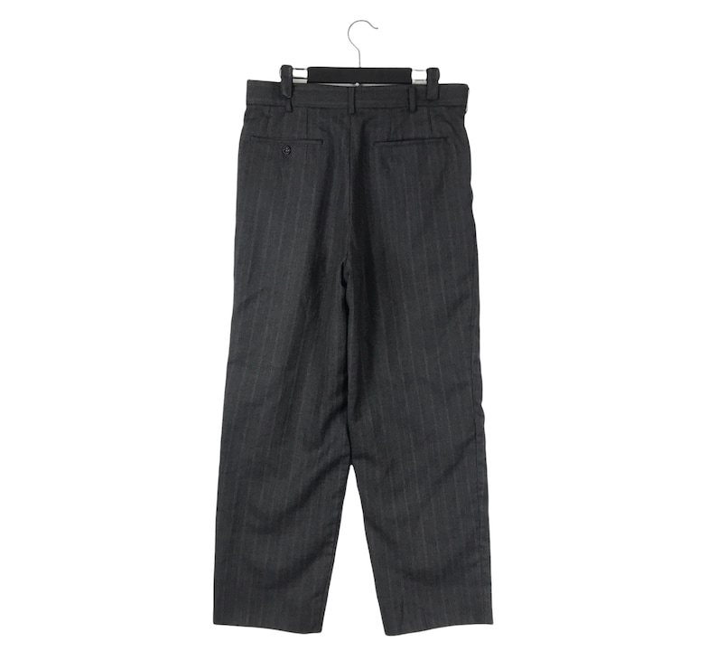 May include: Grey pinstripe trousers with a straight leg and a button fly.