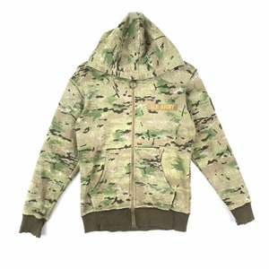 May include: A green, brown, and tan camouflage hooded sweatshirt with a zipper closure. The sweatshirt has a patch on the left chest that says "U.S. ARMY".