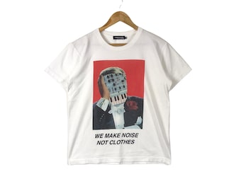 UNDERCOVER ブーツ WE MAKE NOISE NOT CLOTHES Undercover We Make Noise Tee in Black | FWRD