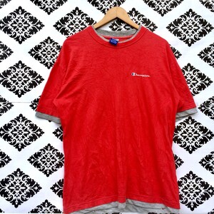 May include: Red short-sleeved t-shirt with a grey underlay and a small embroidered Champion logo on the front.
