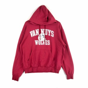 May include: Red hooded sweatshirt with a white graphic print that says "Van Nuys Wolves".