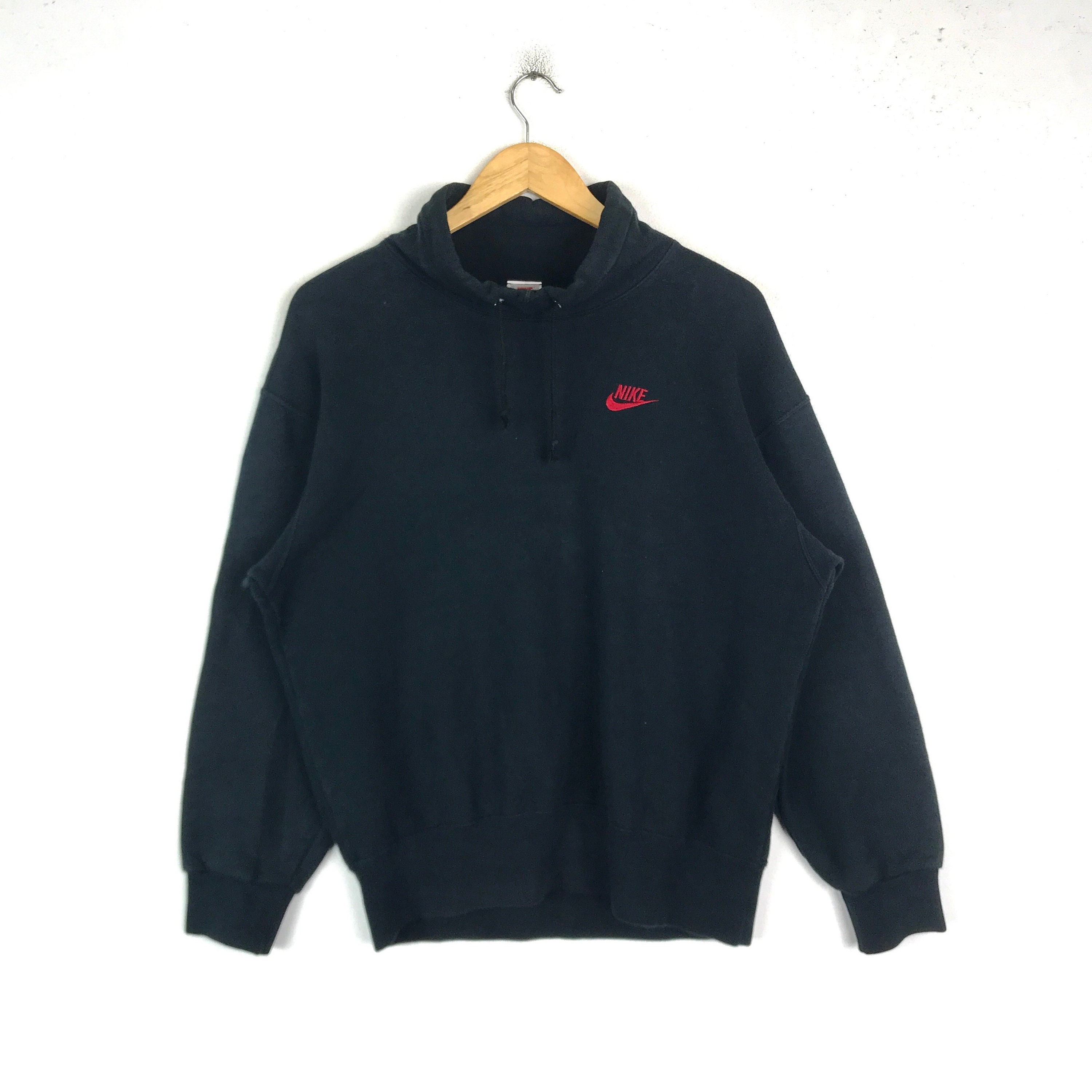 black nike sweatshirt with red tick