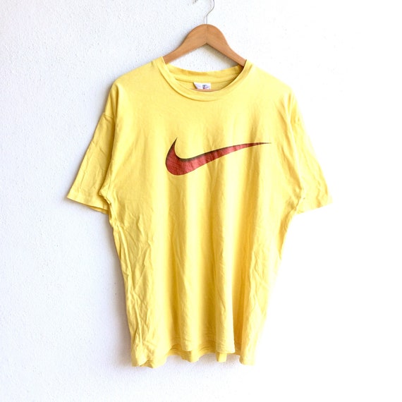 yellow nike t shirt