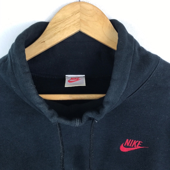 black nike sweatshirt with red tick