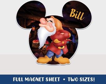 May include: A printable Disney character magnet sheet featuring a grumpy dwarf from Snow White and the Seven Dwarfs. The dwarf is wearing a red and blue outfit and has a white beard. The magnet sheet is shaped like Mickey Mouse ears and has the name "Bill" written on the right ear.