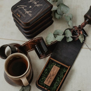 May include: A wooden box with a personalized inscription "Staci & Camden 10.08.2022" and a smaller wooden box inside with the inscription "our forever will start here".