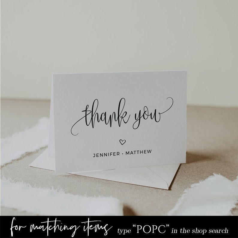 May include: White thank you card with black calligraphy that says "thank you" and a small heart. Below the text is the name "Jennifer Matthew".