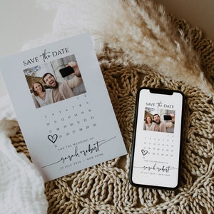 May include: Save the date card with a calendar and a photo of a couple. The card is white with black text and a heart shape. The text says "Save the Date" and "For the wedding of Sarah + Robert" with the date "25 July 2024" and location "New York".