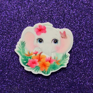 May include: A white elephant with pink ears and a pink flower on its head. The elephant is surrounded by green leaves and pink and orange flowers.
