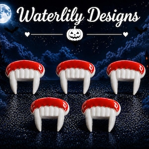 May include: Five vampire teeth charms featuring white fangs and a glossy red gum line. The charms are arranged in a staggered pattern against a dark, atmospheric background that includes the text Waterlily Designs and a pumpkin icon.