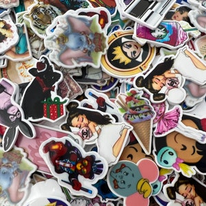 May include: A collection of colourful, white-backed stickers featuring various cartoon characters, animals, and designs. Some of the stickers include a tiger, a cartoon elephant, a cartoon ice cream cone, a cartoon girl with a crown, a cartoon girl sleeping, a cartoon girl with a black cat, a cartoon girl with a bunny, a cartoon girl with a flower, and a cartoon girl with a crown.