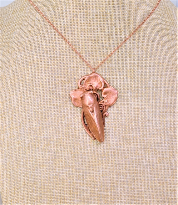 A *real* cicada preserved and electroformed onto an Art Nouveau copper necklace — equal parts entomology cabinet and wearable sculpture.