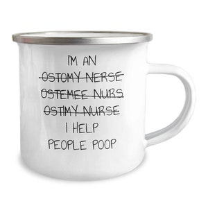 May include: White enamel mug with a silver rim and a white handle. The mug has the text "I'M AN OSTOMY NERSE OSTEMEE NURS OSTIMY NURSE I HELP PEOPLE POOP" in black, handwritten-style font.