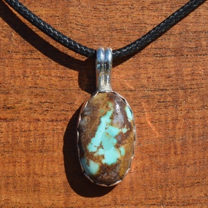 Royston Turquoise Cabochon Pendant Set in Fine Silver.