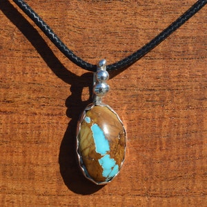 Royston Turquoise Cabochon Pendant Set in Fine Silver.
