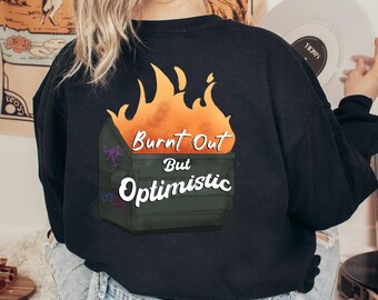 Suéter de cuello redondo quemado pero optimista