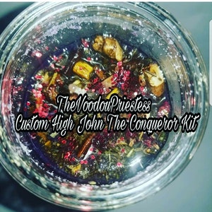 May include: A glass jar filled with a purple liquid and various herbs, roots, and crystals. The jar is labeled "The Voodoo Priestess Custom High John The Conqueror Kit."