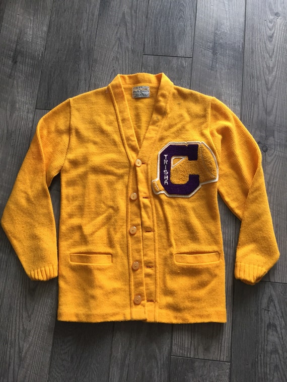 purple and yellow varsity jacket