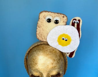 breakfast headband,with bacon,eggs,and toast.