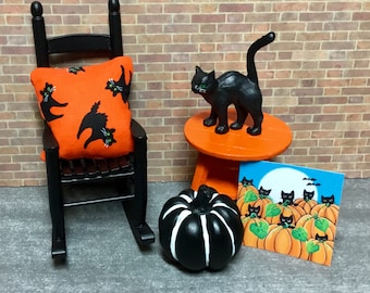 Dollhouse Miniature Halloween Decor, Black Wooden Rocker, Orange Wooden Table, Black Cat Pillow, Black Cat, Black & White Pumpkin.