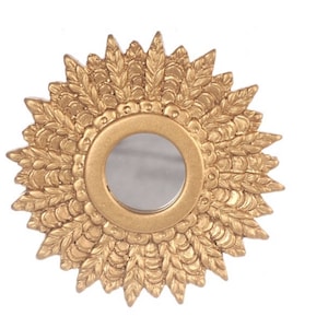 May include: A gold-toned round mirror with a decorative, sunburst-shaped frame. The frame is made of a textured, leaf-like design.