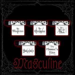 May include: Five small clear glass vials with black caps, each featuring a white label with black moon and leaf motifs. The labels display the text The Magician, The Emperor, The Hanged Man, Judgment, and The Hunter's Kiss. The word Masculine is in red.