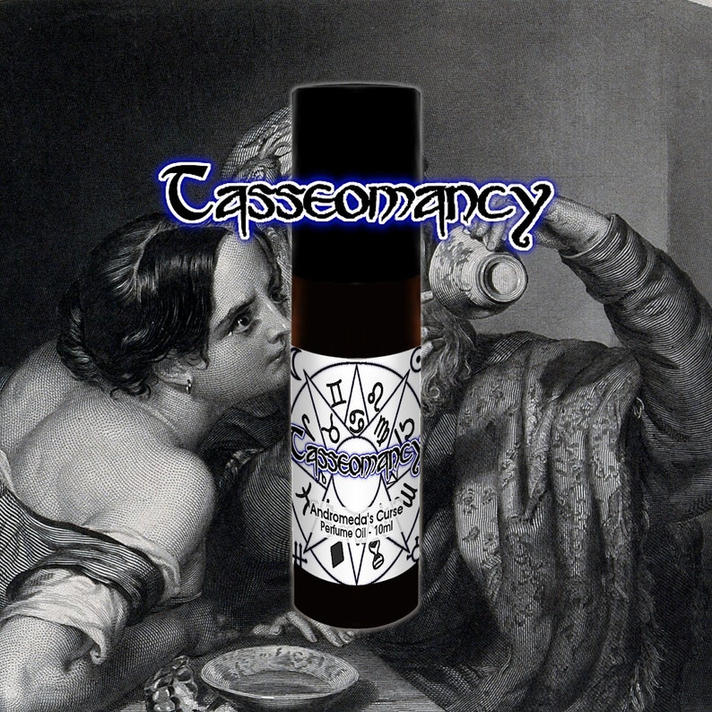 May include: A black roll-on bottle with a white label that reads "Casseomancy Andromeda's Curse Perfume Oil - 10ml". The label also features a black and white pentagram with astrological symbols.